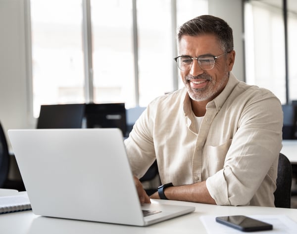 Man working on his laptop image